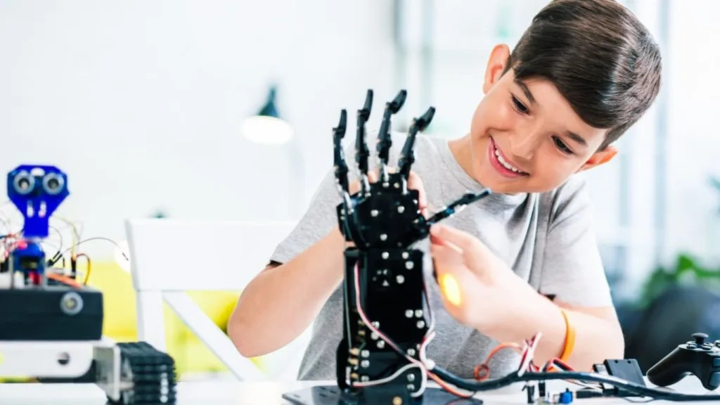 Student working with robotics during a workshop