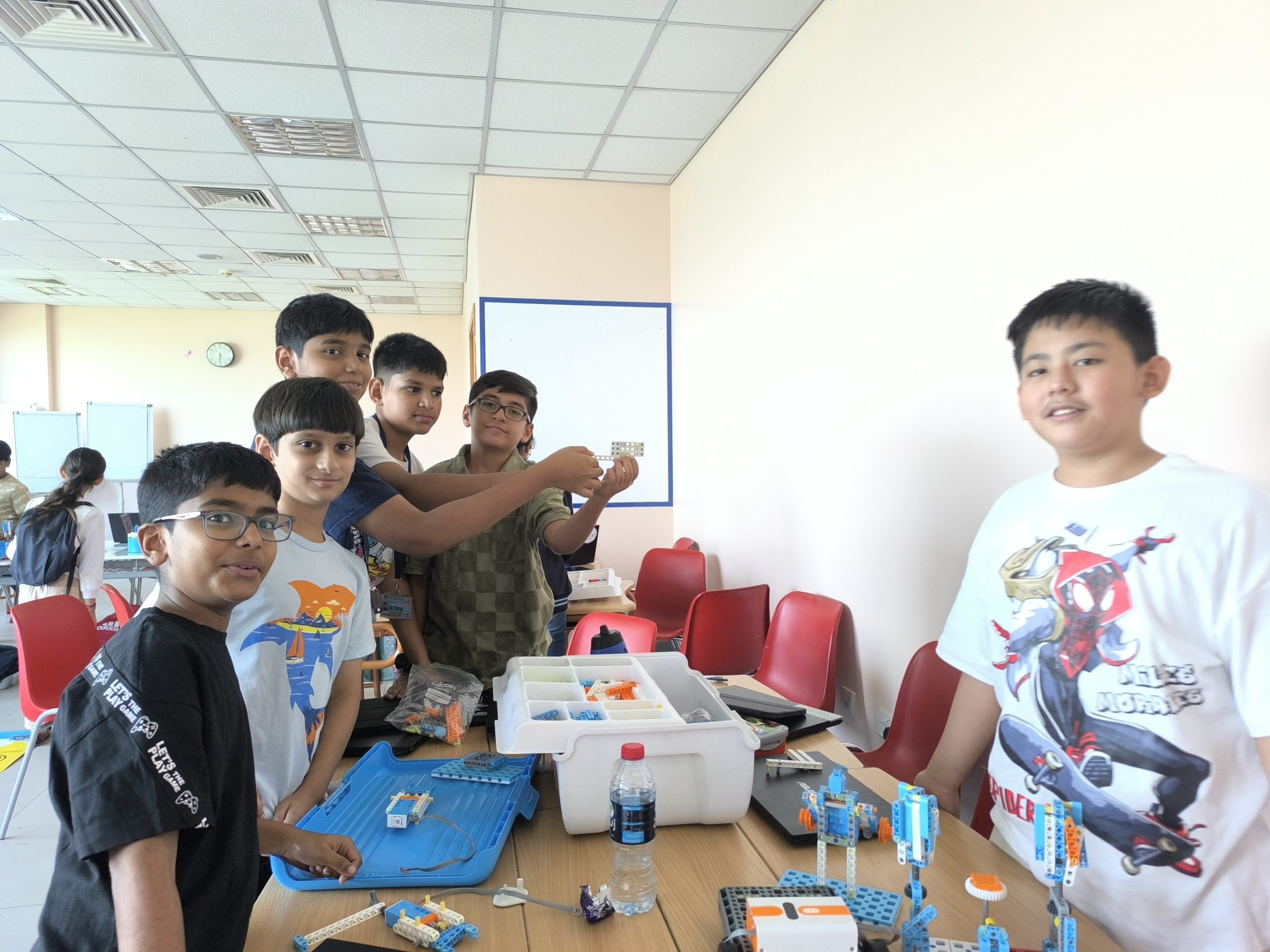 Students participating in a group coding activity at an EduStream workshop
